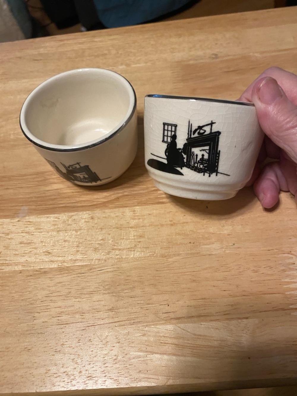 Pottery custard cups (2) with silhouette pattern.